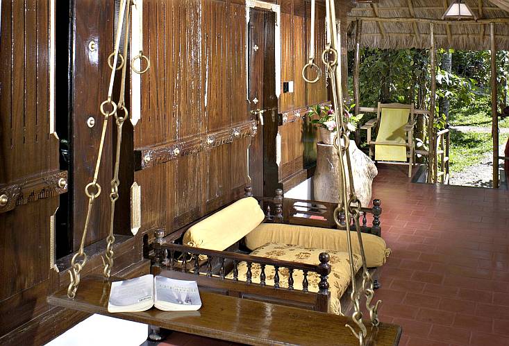 While some cottages at Shalimar are built in modern European style, others are constructed in the traditional Kerala style of architecture called Nalukettu, with wooden flooring and carvings and slotted wood on the ceiling and doors—complete with an Aattu Kattil (swinging wooden bed) oscillating in the sit out area 