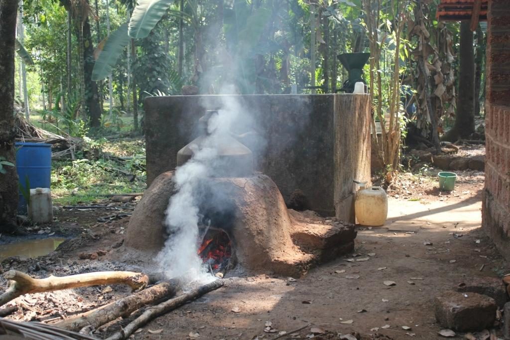 Distillation of cashew feni at Dudhsagar Plantation organic farmstay Goa.